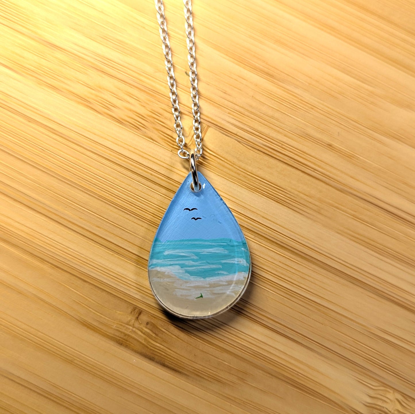 Gentle beach hand painted resin necklace