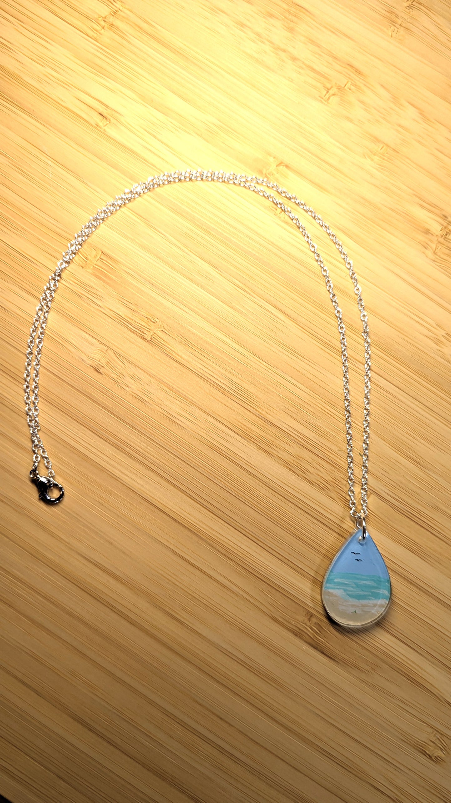 Gentle beach hand painted resin necklace