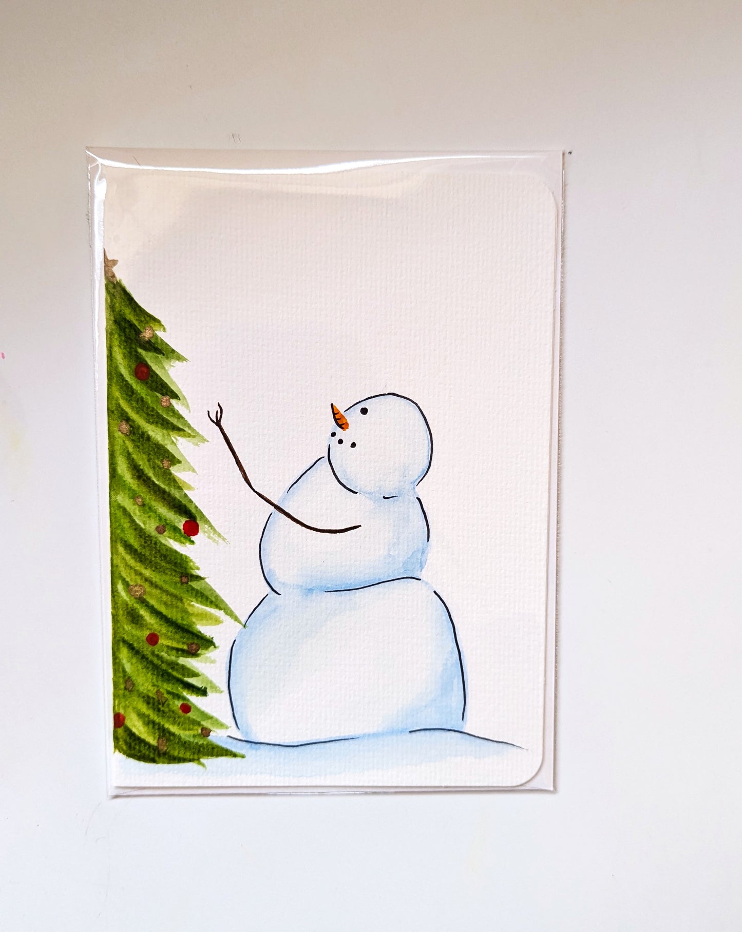 Christmas Card - Snowman decorating a Christmas tree, hand painted watercolor, blank inside